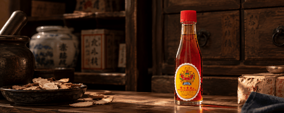 Po Sum On Oil in front of vintage cabinets